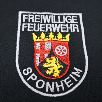 Emblem der Freiwilligen Feuerwehr Sponheim mit Wappen und Löwenmotiv.