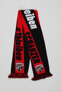 Schwarzer und roter Schal mit dem Text '#1bleiben' und dem Vereinslogo in Weiß.