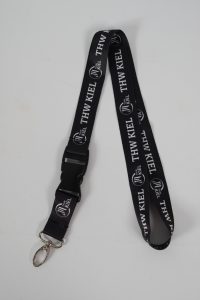 Schlüsselband in Schwarz mit THW Kiel Logo und einem Clipverschluss.