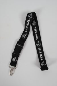 Schlüsselband in Schwarz mit dem Logo von THW Kiel und einem Clip zur Befestigung.