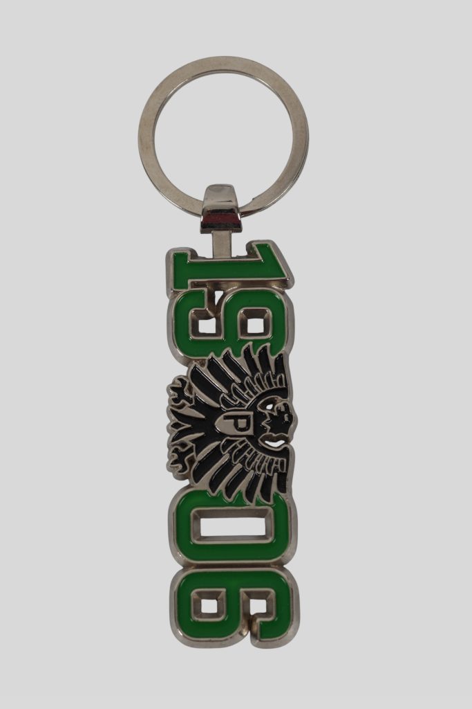 Schlüsselanhänger mit grünen Zahlen 1990 und einem Adler-Symbol in der Mitte.